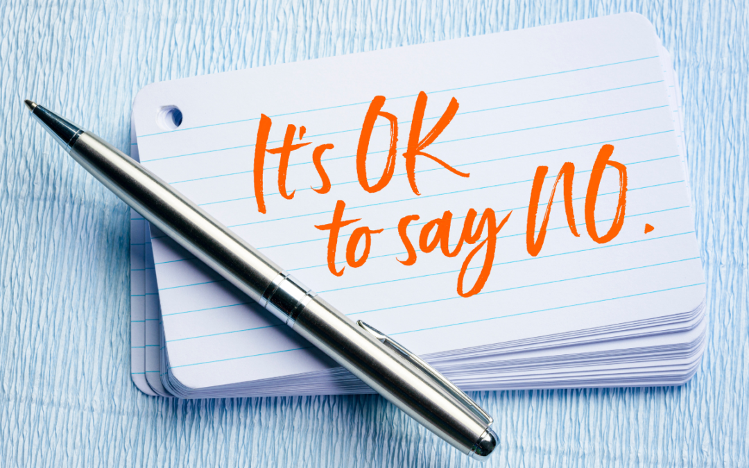 The image shows a stack of paper with "it's ok to say no" written at top.